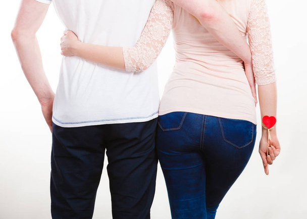 Rear view of hugging couple. - 写真・画像
