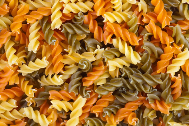 Multicolor spiral macaroni. - Zdjęcie, obraz
