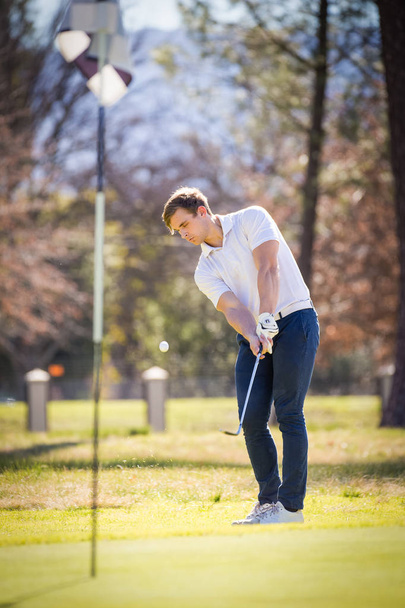 golfer planning his shot to the pin - Photo, Image