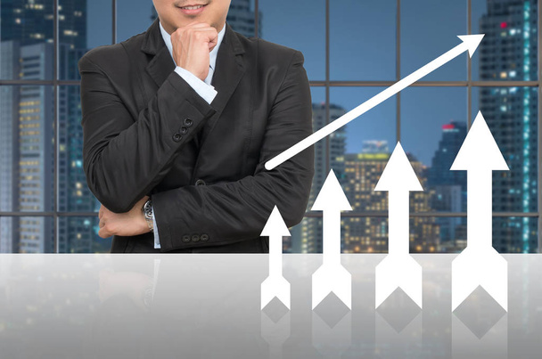 Businessman with growth up arrow  - Photo, Image