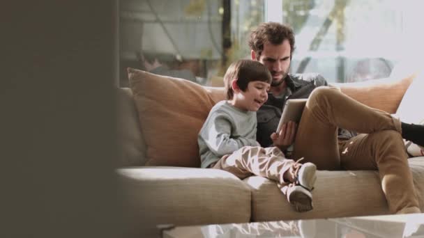Father and son using tablet   - Felvétel, videó