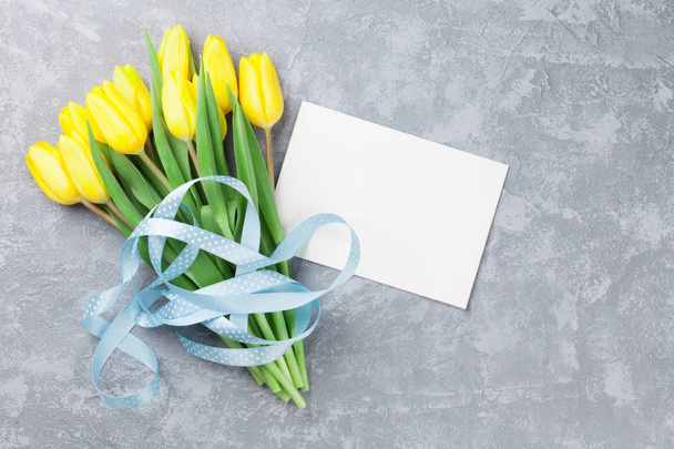 Easter card and yellow tulips - Фото, зображення