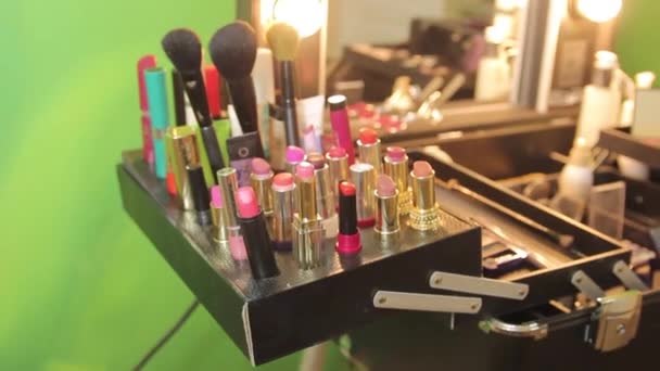 Makeup brush and cosmetics on the table - Felvétel, videó