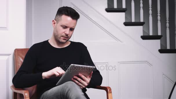Male working on digital tablet - Video
