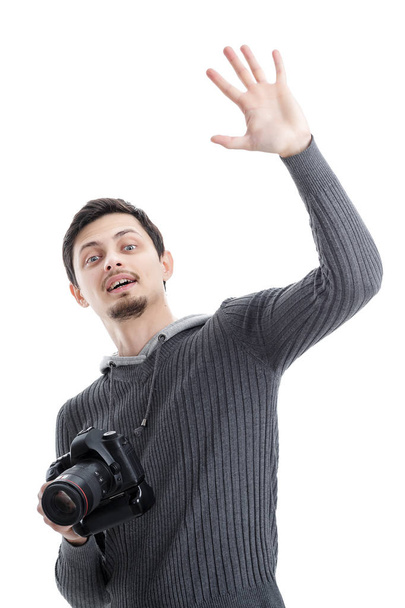 young professional photographer with digital camera waving Hello - Foto, immagini