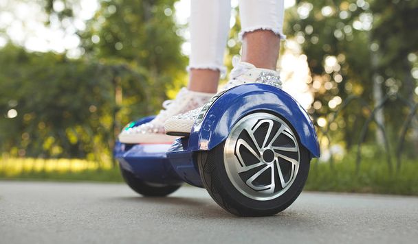 woman feet on hoverboard - Photo, Image