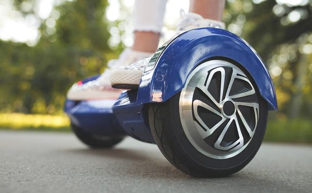 woman feet on hoverboard - Photo, Image