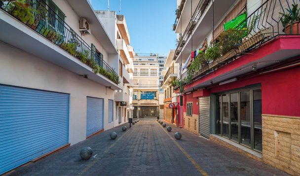 Vacant & shaded alleyway on otherwise bright sunlit day.  Ibiza off-season in the afternoon.  - Photo, Image