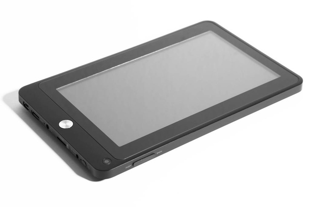 Tableta negra con pantalla gris acostada con sombra frontal derecha
 - Foto, imagen