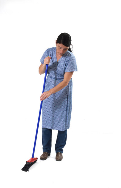 woman sweeping on white  - Фото, зображення