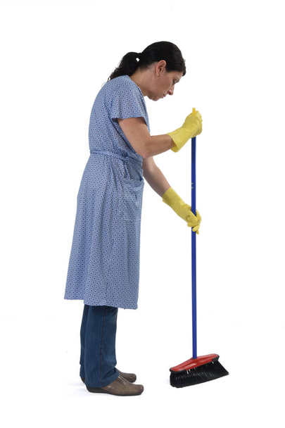 woman sweeping on white  - Valokuva, kuva