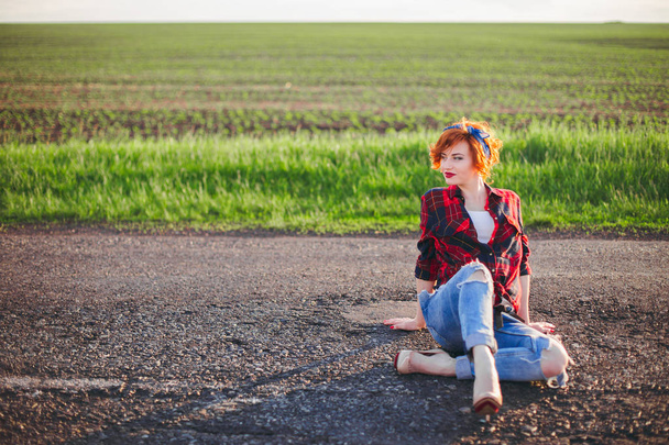 Girl on a green field background - Φωτογραφία, εικόνα