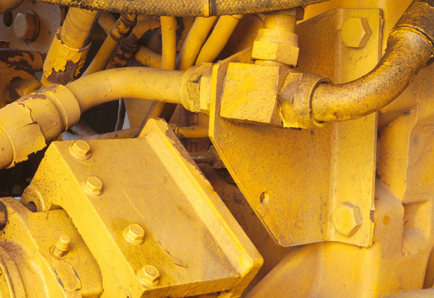 naprawa maszyn hydraulicznych koparki traktor silnik szczegół z żółtym - Zdjęcie, obraz