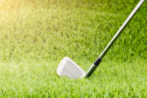 Golf club on green grass with sunlight - Photo, Image