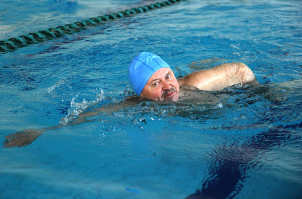 Middle Aged man in Swimming Pool - Fotó, kép