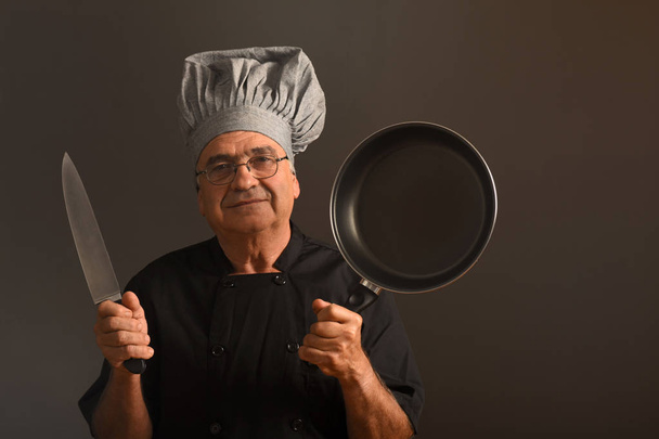 Portrait of a senior chef - Photo, Image