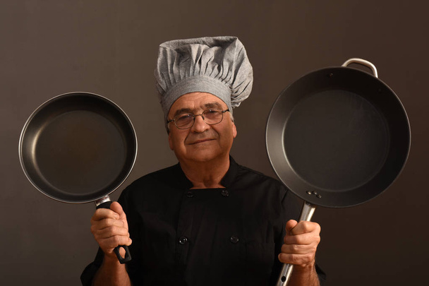 Portrait of a senior chef - Photo, Image
