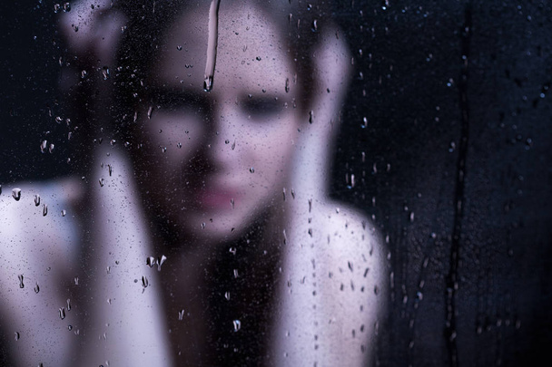 Blured image of depressed girl - Foto, imagen