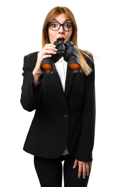 Young business woman with binoculars - Photo, Image