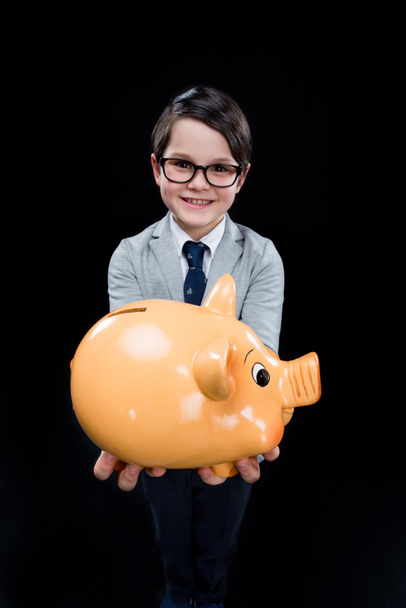 Boy with piggy bank - 写真・画像
