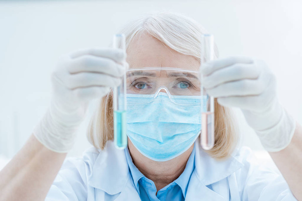 senior chemist with test tubes  - Фото, зображення