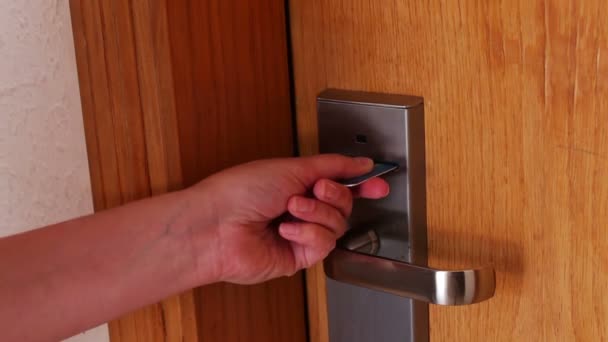 woman opens the door with the key card - Footage, Video