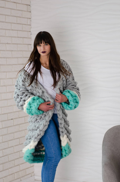 Young fashionable woman in merino wool jacket - Foto, afbeelding
