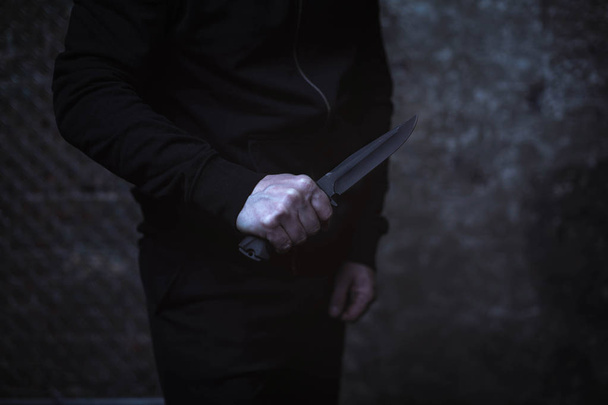 Dangerous criminal holding up knife  - Zdjęcie, obraz