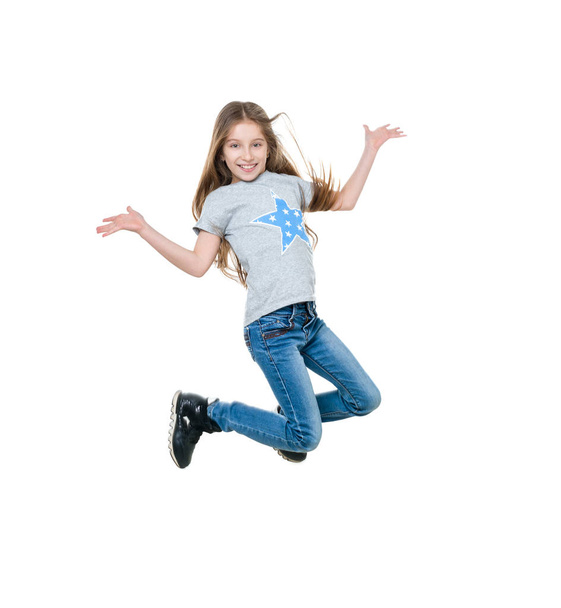 preteen girl dancing and jumping, isolated - Fotoğraf, Görsel