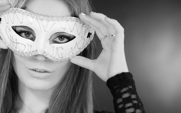 Woman holding carnival mask closeup - Foto, immagini