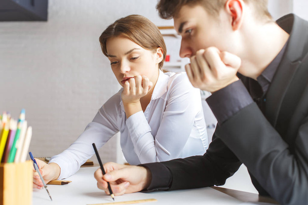 Guy and girl doing paperwork - Photo, Image