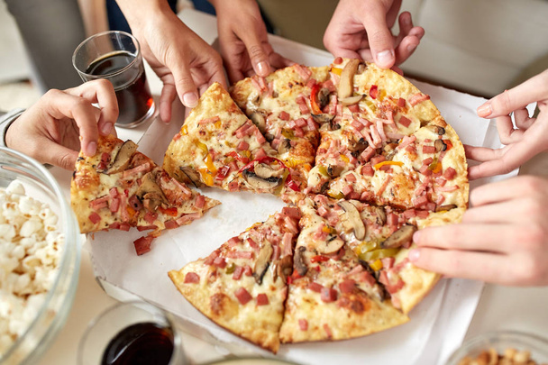 close up of people taking pizza slices from box - Fotoğraf, Görsel