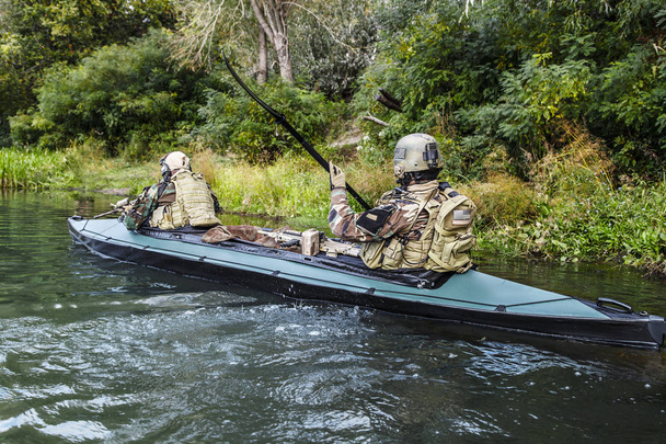 Militants in army kayak - Photo, Image
