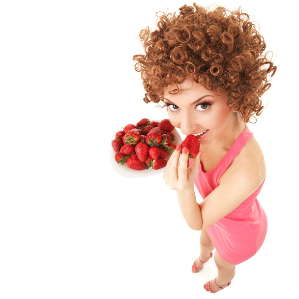 Fun woman with strawberry on the white background - Fotoğraf, Görsel