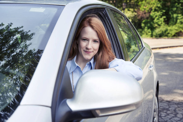 Teenager girl sitting in car - Photo, Image
