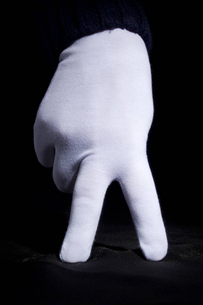 Hand in a white glove - Foto, afbeelding