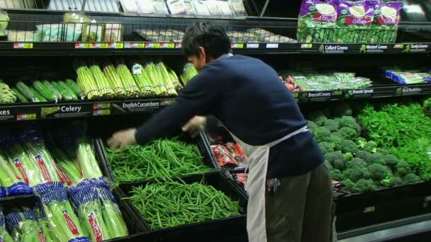 Man Inspecting Green Beans In Produce - Footage, Video