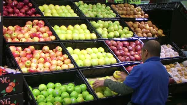 Man Facing Apples In Produce - Footage, Video