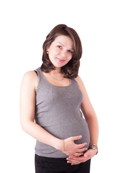 Portrait of a cute young pregnant woman in the studio, isolated. - Foto, Imagem
