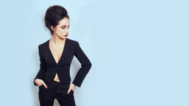 Sexy slim brunette woman posing in studio wearing fashionable jacket - Zdjęcie, obraz