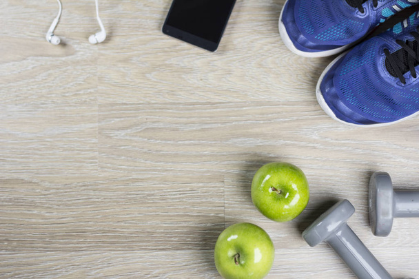Fitness concept. ketlebbells and green apple measuring tape. Copyspace. Banner. - Foto, Imagen