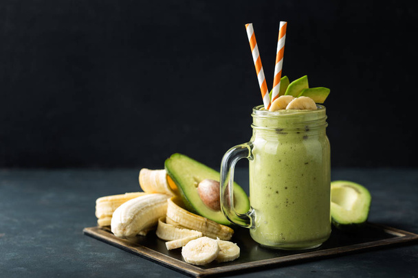 Fresh blended Banana and avocado smoothie with yogurt or milk in mason jar, healthy eating - Zdjęcie, obraz