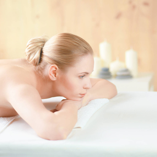 Beautiful young woman getting spa massage, lying on salon - Foto, immagini