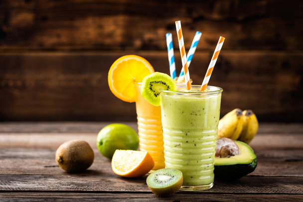 orange and green smoothies with exotic fruits, healthy eating, superfood - Photo, Image