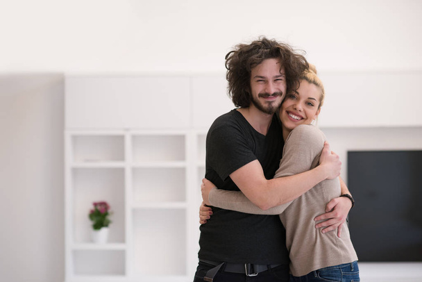 couple hugging in their new home - Foto, Bild