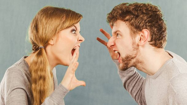 Husband and wife yelling and arguing. - 写真・画像
