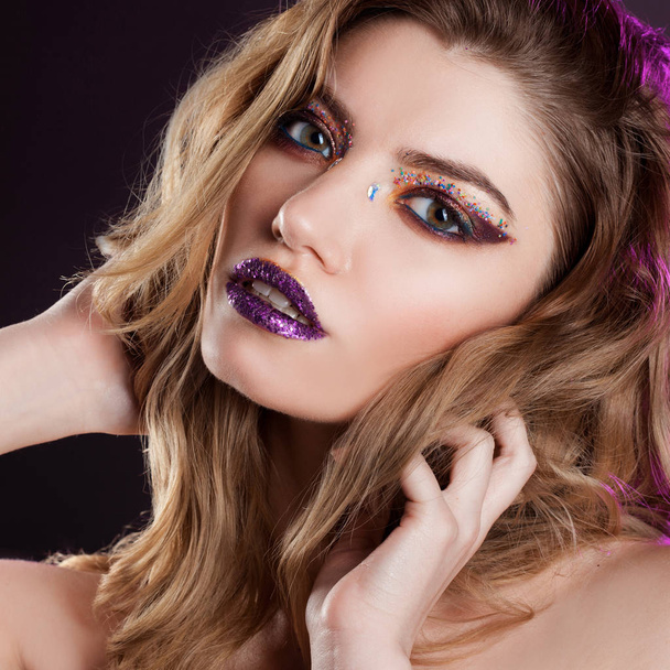 Young beautiful girl with creative make up. Attractive blonde, close-up - Fotó, kép