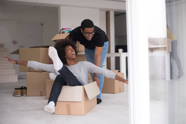 African American couple  playing with packing material - 写真・画像