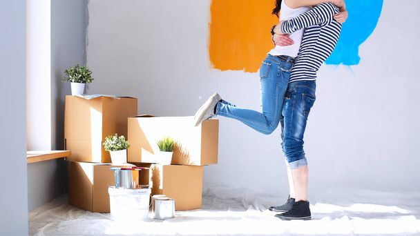 Happy young couple moving in new house - 写真・画像