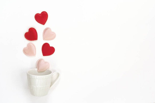 Coffee cup with hearts coming out of it  on a white background.  - Foto, Imagen